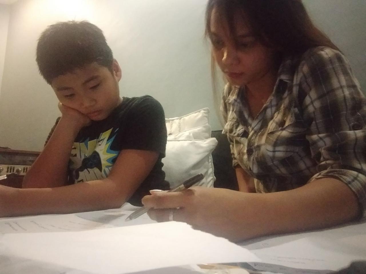 Teacher Edlyn with Luis